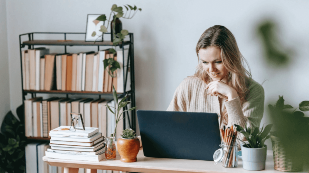 Millennial employees; a young woman works from her home office