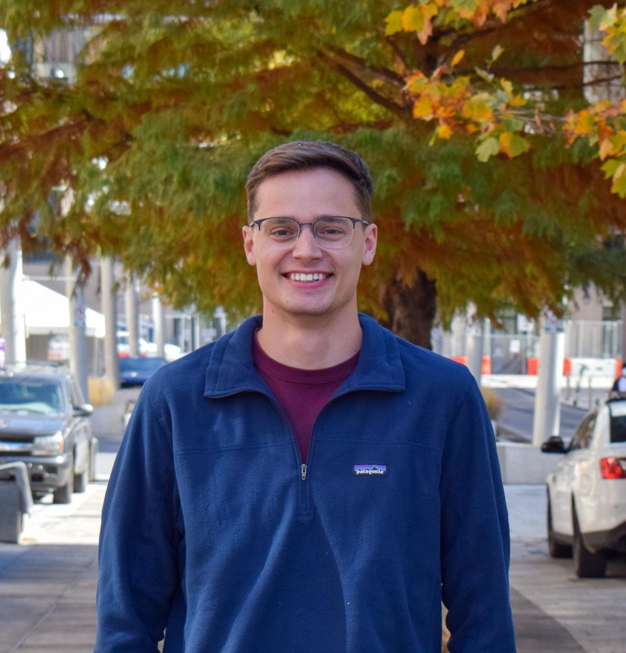 Head shot of Alex Milner, Content Marketing Specialist at rater8
