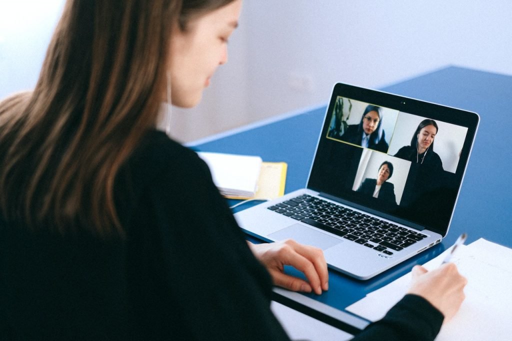 Team members on a video call, all of different age groups.