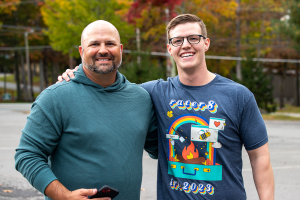 rater8 employees pose with the company's bumblebee mascot