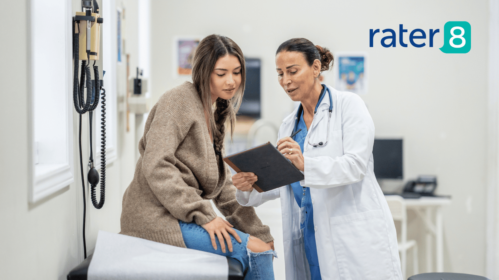Doctor showing patient medical information on a tablet device