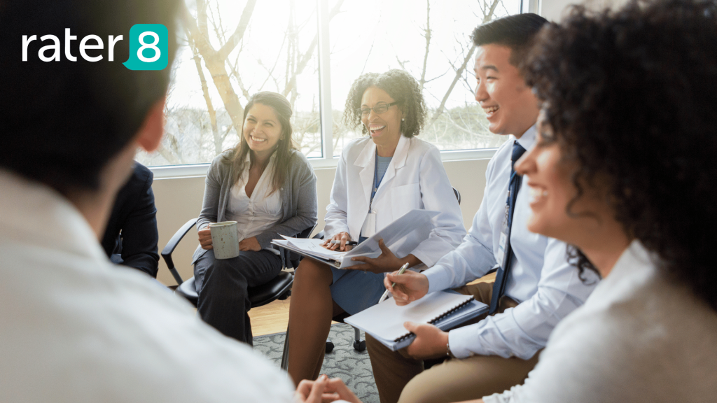 A group of healthcare professionals sitting in a meeting
